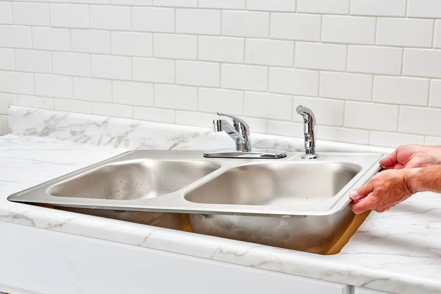 How much does it cost to hire a professional plumber to install a double kitchen sink with a disposal and dishwasher