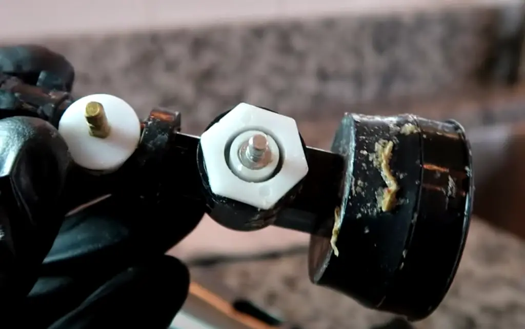 How do you fix a stuck kitchen faucet sprayer?