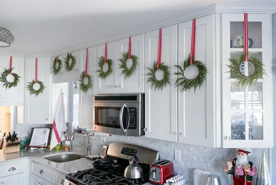 Fall Wreath Between Kitchen Cabinet Crown Molding
